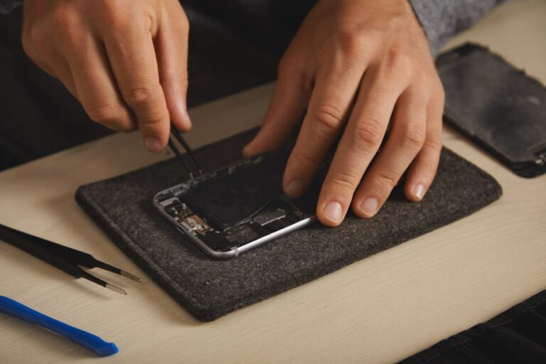 removing-old-bli-battery-from-disassembled-smartphone-replace-it-with-new-one-electronic-repairment-service_346278-1204